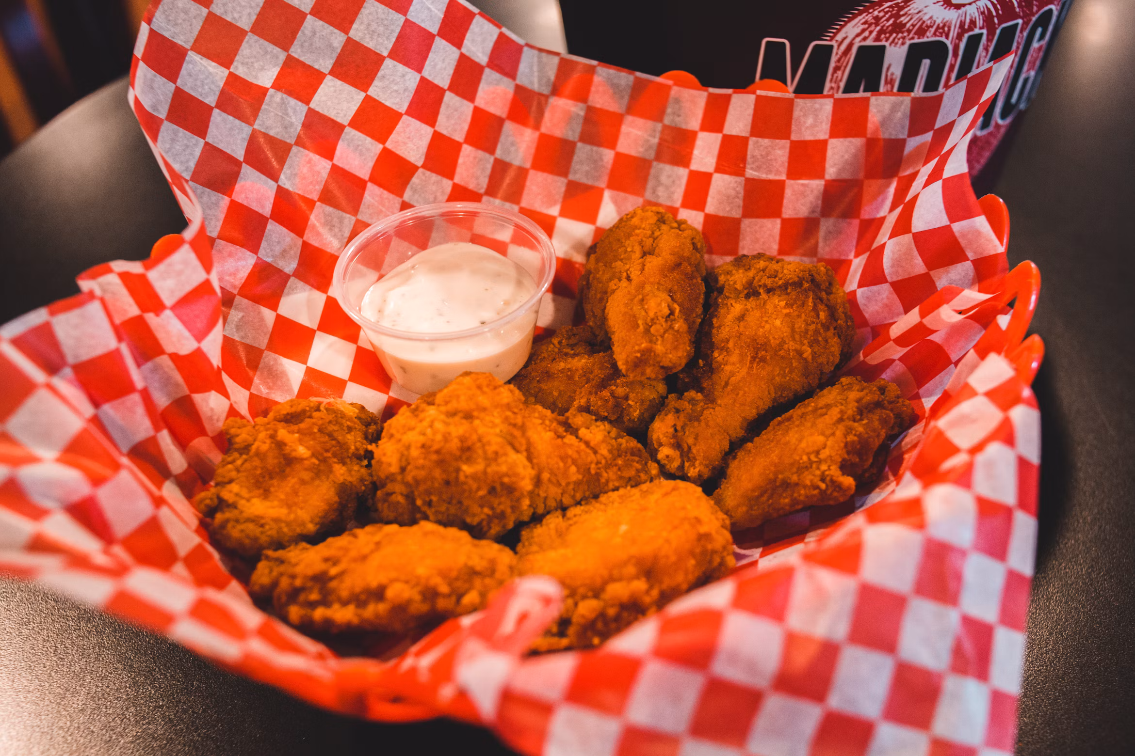 Assorted wing flavors in catering trays
